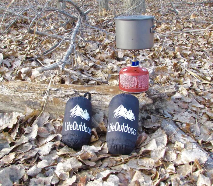 Two LiteOutdoors Hammock Rain Fly sitting side by side showing how compact the tarps can get.